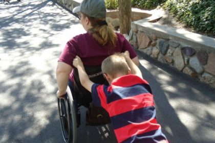 kid-pushing-wheelchair-670×335