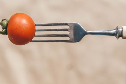 Cherry tomato on fork