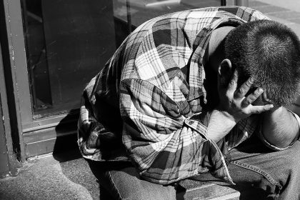 man-crying-into-hands