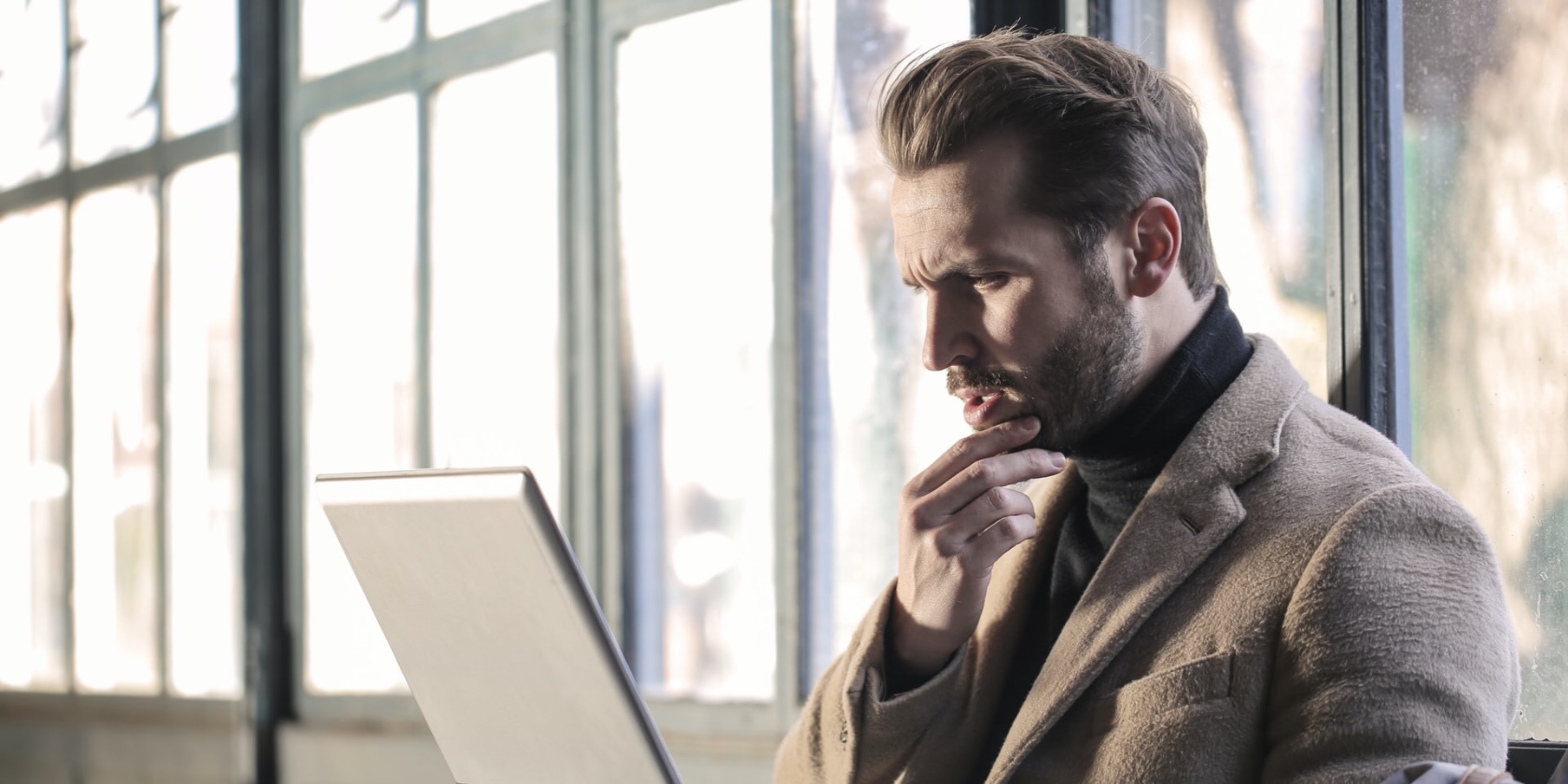 Man looking at laptop screen