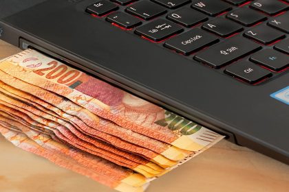 money-coming-out-of-a-laptop-slot